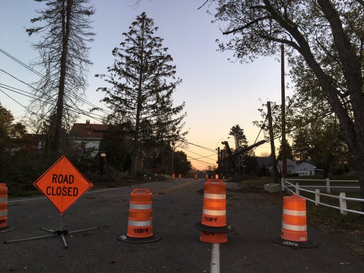 A road in Cape Elizabeth was shut down Monday because of downed power lines. Photo by Jessica Conley, WCSH