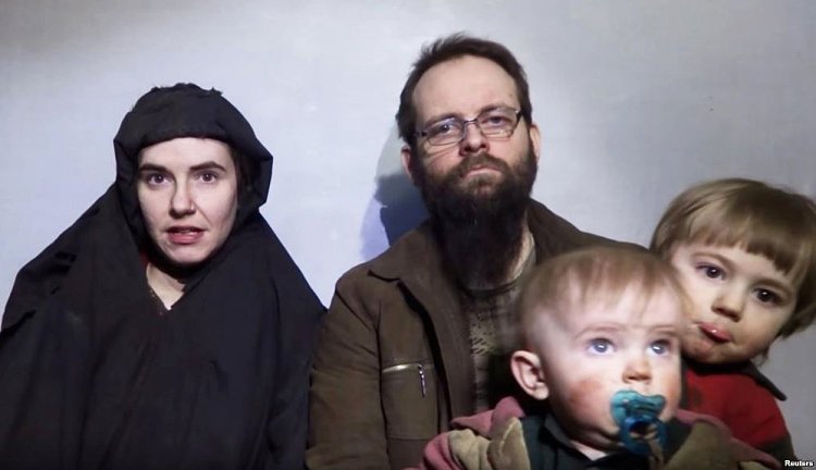 A still image from a video posted by the Taliban on social media on Dec. 19, 2016, shows American Caitlan Coleman speaking next to her Canadian husband, Joshua Boyle, and their two sons.