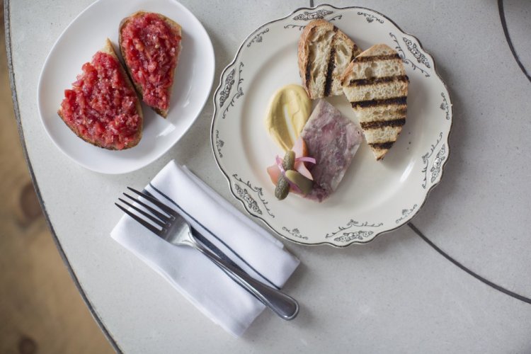 Tomato bread, Chaval's version of Spanish pan con tomate, and pork terrine, served with Dijon mustard and topped with homemade pickled local pear.