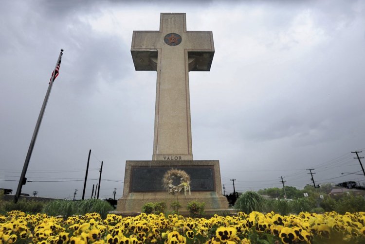 The World War I memorial cross on a Maryland highway median is pictured in Bladensburg, Md.