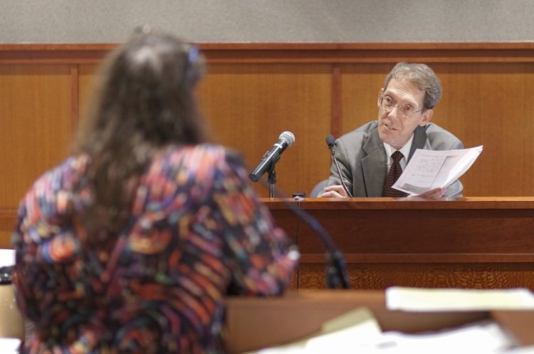 Ned Chester, one of Anthony Sanborn's attorneys during his 1992 murder trial, reviews documents with attorney Amy Fairfield during Sanborn's post-conviction review at the Cumberland County Courthouse on Monday. Sanborn spent 27 years in jail for the murder of Jessica Briggs but was released on bail in April after a key eyewitness for the state recanted testimony she gave at the 1992 trial.