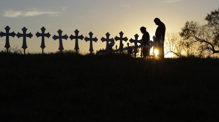 Kenneth and Irene Hernandez pay their respects as they visit a makeshift memorial with crosses placed near the scene of a shooting at the First Baptist Church of Sutherland Springs, Texas, in November, 2017.