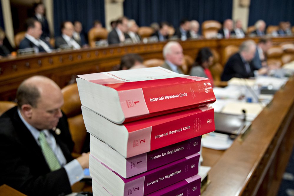 Tax code books sit on a table Nov. 6 as a House panel begins markup of the Republican tax bill.
