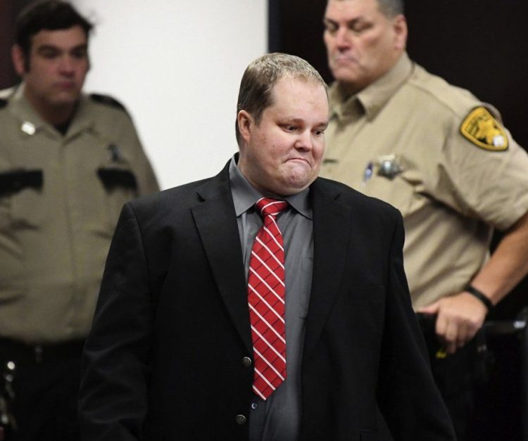 William Hudson walks into court on Nov. 1, the first day of his trial in Bryan, Texas. A jury took only 20 minutes Tuesday to find Hudson guilty of capital murder in the 2015 deaths of six people, including two from Maine. Authorities say William Hudson got angry after learning that two families had cut a lock to a gate to gain access to land they owned for a weekend of camping. 