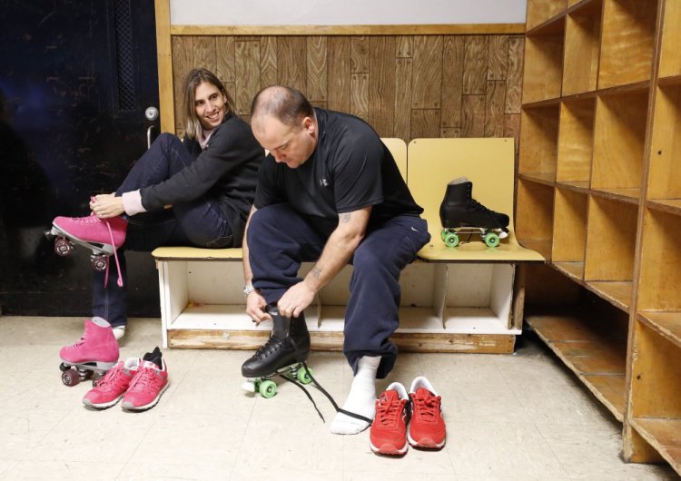 Anthony and Michelle Sanborn lace up their skates Thursday at Rollodrome in Auburn, a day after a deal in his post-conviction review released him from the rest of his 70-year sentence. He said, "I woke up this morning and I thought, 'I'm free, I don't have to worry about going to the jail again."