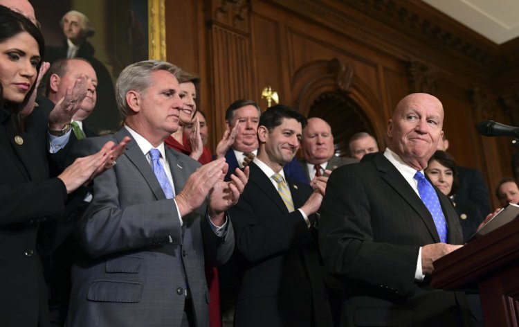 House Ways and Means Committee Chairman Rep. Kevin Brady, R-Texas, right, pauses as he speaks during a news conference following a vote on tax reform on Capitol Hill in Washington on Thursday.