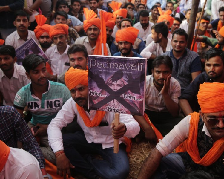 Members of India's Rajput community hold placards as they protest on Monday against the release of Bollywood film "Padmavati" in Mumbai, India. (AP Photo/Rafiq Maqbool)