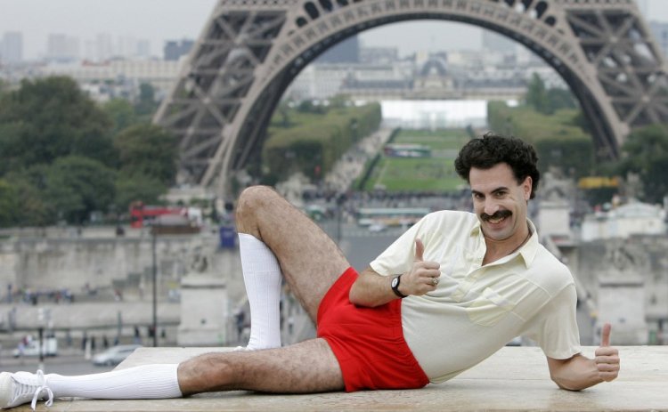 British actor Sacha Baron Cohen, dressed as his character "Borat," poses near the Eiffel tower in Paris in 2006.
