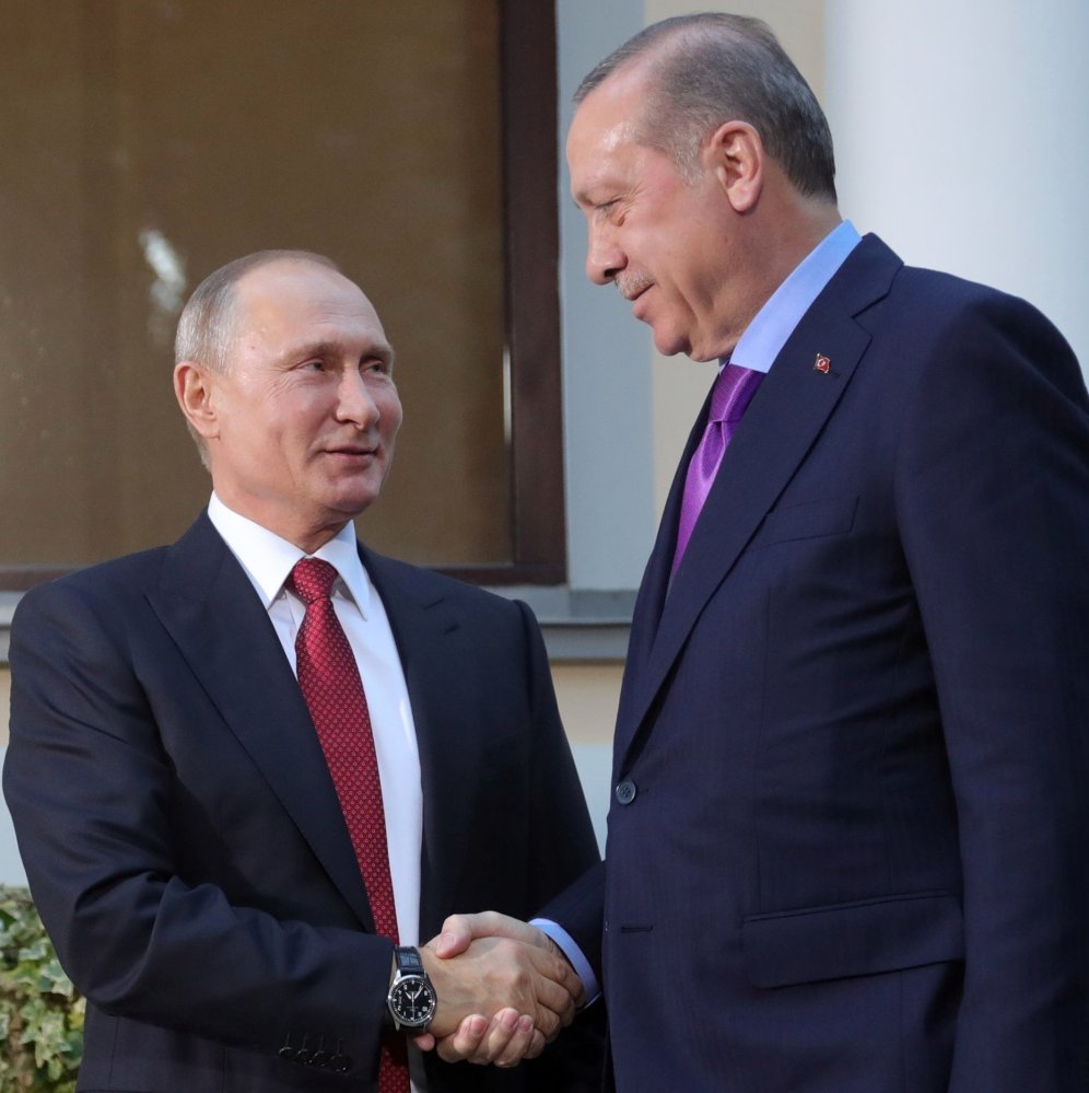 Russian President Vladimir Putin, left, and Turkish President Recep Tayyip Erdogan meet at the start of talks Tuesday in Russia. Erdogan has opposed the U.S. arming of Syrian Kurds to fight the Islamic State.