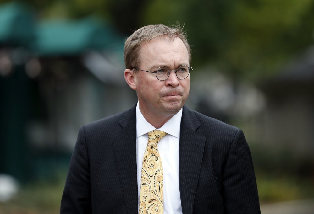 Director of the Office of Management and Budget Mick Mulvaney departs after a television interview at the White House in Washington. Mulvaney is Trump's pick for temporary director of the Consumer Financial Protection Bureau but a lawsuit was filed Sunday night to keep Leandra English, the acting director, in the post after she was appointed by outgoing director Richard Cordray.
