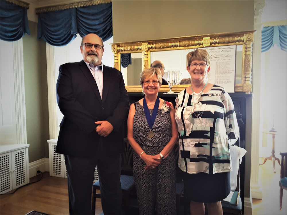 The 2017 Mother of the Year Kitty White, center, recently was honored at a silver tea reception at the Blaine House in Augusta. She was presented with proclamations from Rep. Donna Doore, D-Augusta, right, and Augusta's Mayor David Rollins.