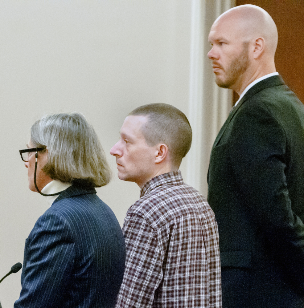 Scott A. Bubar, 40, center, is flanked by his attorneys, Lisa Whittier, left, and Scott Hess, during a bail hearing Wednesday at the Capital Judicial Center in Augusta. Bubar admitted having violated bail conditions established in connection with his attempted murder charge.