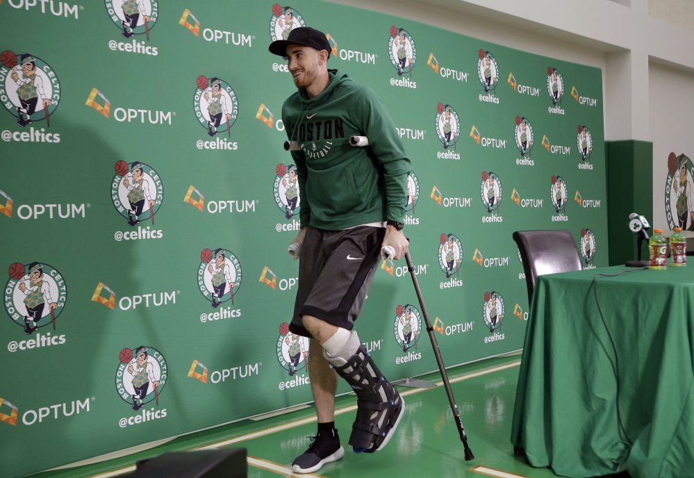 Boston's Gordon Hayward uses crutches as he steps away from a podium after taking questions from members of the media at a news conference Thursday at the team's' training facility in Waltham, Massachusetts. Hayward, who broke his ankle in his Celtics' debut at Cleveland on Oct. 17, says he knows he will not play again this season, after needing surgery to repair the injury.