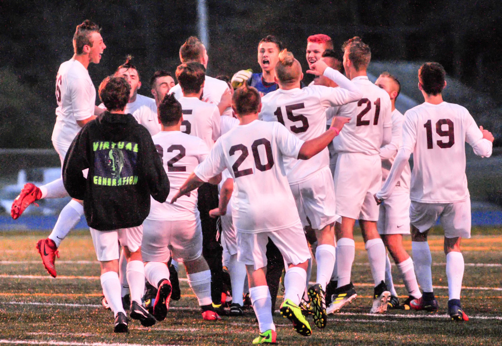 After time expires, the Richmond boys soccer team celebrates after winning the Class D South championship Thursday at McMann Field in Bath.