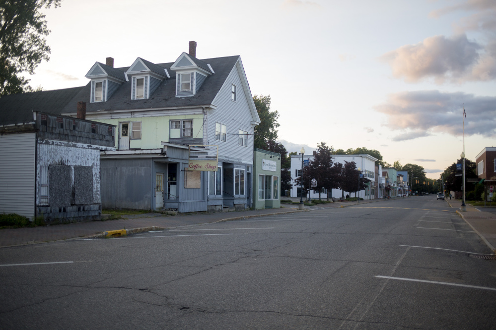 Downtown Millinocket on a Wednesday evening. The town has suffered economically since the mill closures, but there are a few new businesses popping up in a few of the shuttered stores in downtown since the designating of the national monument. (Photo by Brianna Soukup/Maine Sunday Telegram)