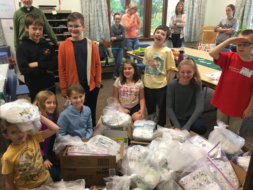 A group of volunteers from St. Mark's Church in Waterville, gathered Oct. 15 to pack diapers for the Essentials Closet at the Waterville United Church of Christ. Front, from left, are Penny Graham, Sarah and Catherine Mansir, Brooke Pullen, Gus Graham, Elizabeth Hardy, Caleb Knock. Second row, from left, are Colby Hardy and Jonathan Eccher-Mullally. Back row, from left, are John Balicki, rector of St. Mark's; Sally Stokes, Bess Stokes, Angela Hardy and Maggie Stokes.