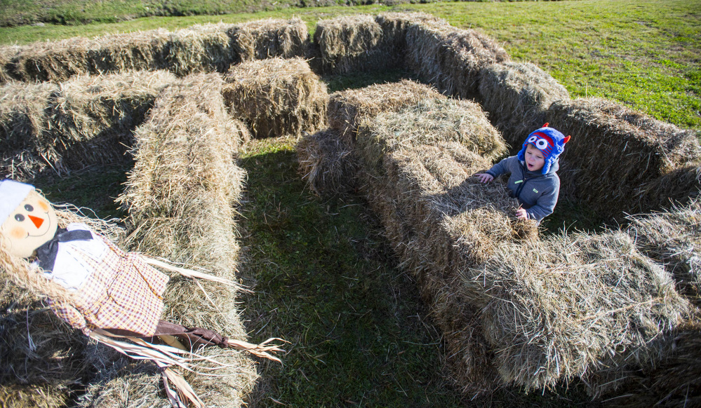 Griffin Laplante, 3, of Waterville, works his way through a hay maze Saturday at the Fall Family Fun Day event at Quarry Road Trails in Waterville.
