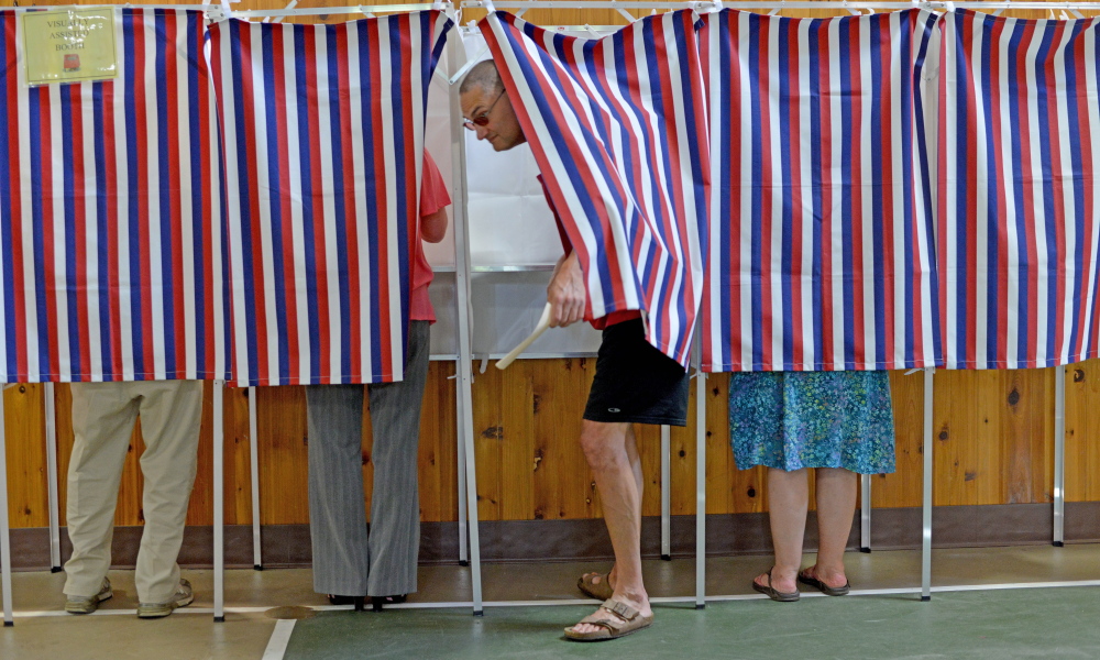 Voters cast their ballots June 30, 2015, in the booths at the Belgrade Community Center.