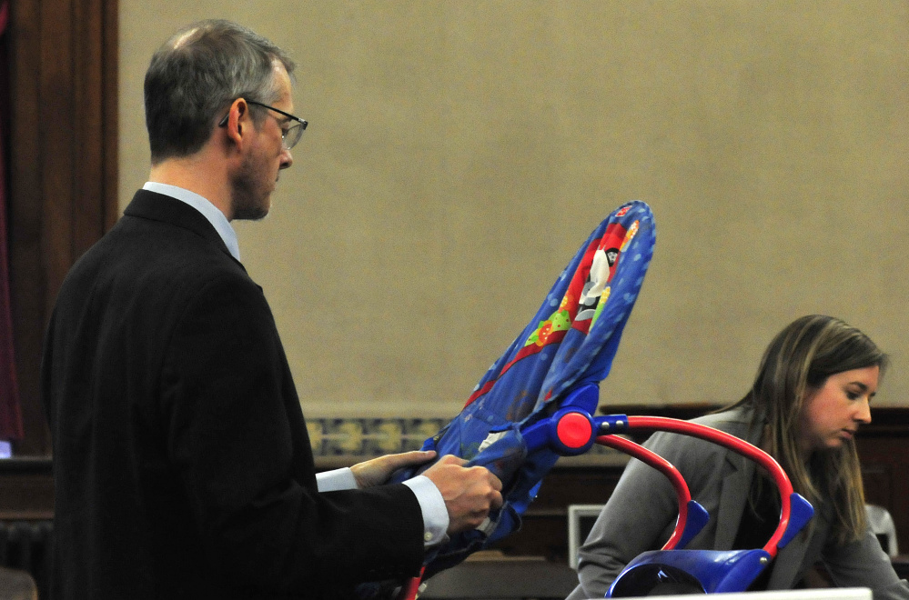 Defense attorneys Christopher MacLean and Laura Shaw showed the jury an infant seat used by deceased infant Jaxson Hopkins during the manslaughter trial of his mother, Miranda Hopkins of Troy, in Waldo County Superior Court in Belfast on Monday.