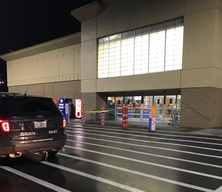 Crime scene tape blocks the entrance to Walmart in Augusta Monday night as police investigate a report of shots fired in the store. Police say no one was injured.