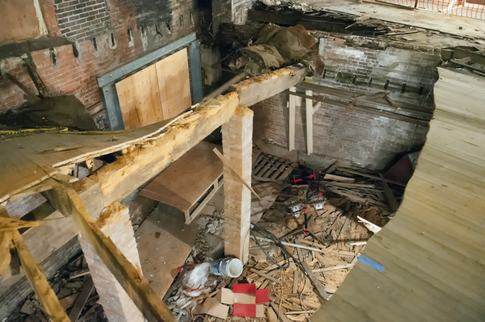 Supporters of the Colonial Theatre in Augusta say they need money from the city to remove coal dust and asbestos from the basement so they can repair the hole in the floor.