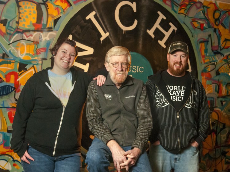 From left, Samantha Robinson, John Callinan and Jason Goucher gather on Tuesday at Niche Inc. in Gardiner. Callinan, who runs the Craft Beer Cellar, and Robinson and Goucher, who run Niche Inc., started their businesses two years ago.