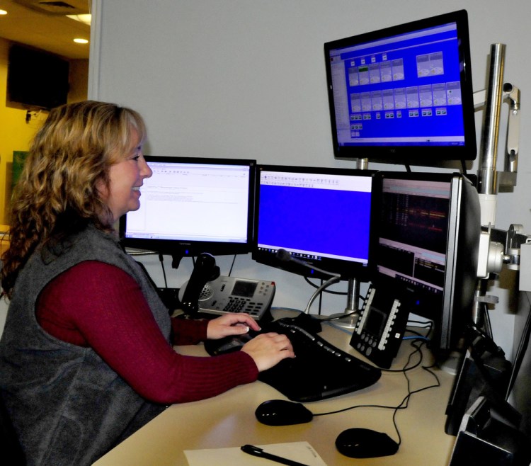 Dispatcher Terri Dessent fields a call Wednesday afternoon at the Waterville Area Communications Center. The Waterville City Council on Wednesday night authorized the city manager to renew the city's police dispatch contracts with area towns at a 3 percent increase.