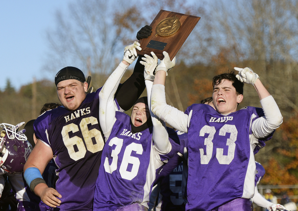 Marshwood players  Seth Aumann, Kyle Glidden and Max Horton celebrate after they won the B South championship Saturday afternoon.