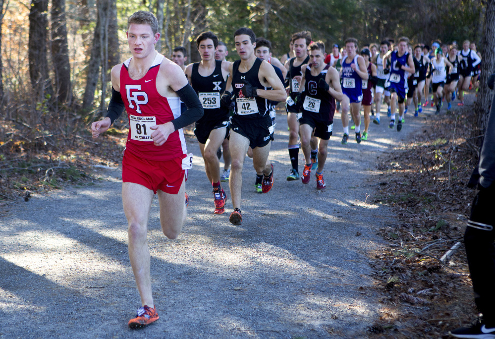 Fairfield (Connecticut) Prep runner Drew Thompson, left, leads the pack during the 83rd annual New England cross country championships Saturday at Troy Howard Middle School in Belfast. Thompson won the race.