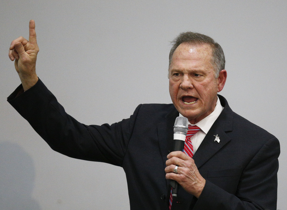 Former Alabama Chief Justice and U.S. Senate candidate Roy Moore speaks at a church revival Tuesday. U.S. Rep. Bruce Poliquin, R-2nd District, saids Moore should drop out of the Senate race in Alabama if several recent sexual harassment accusations against him are true.