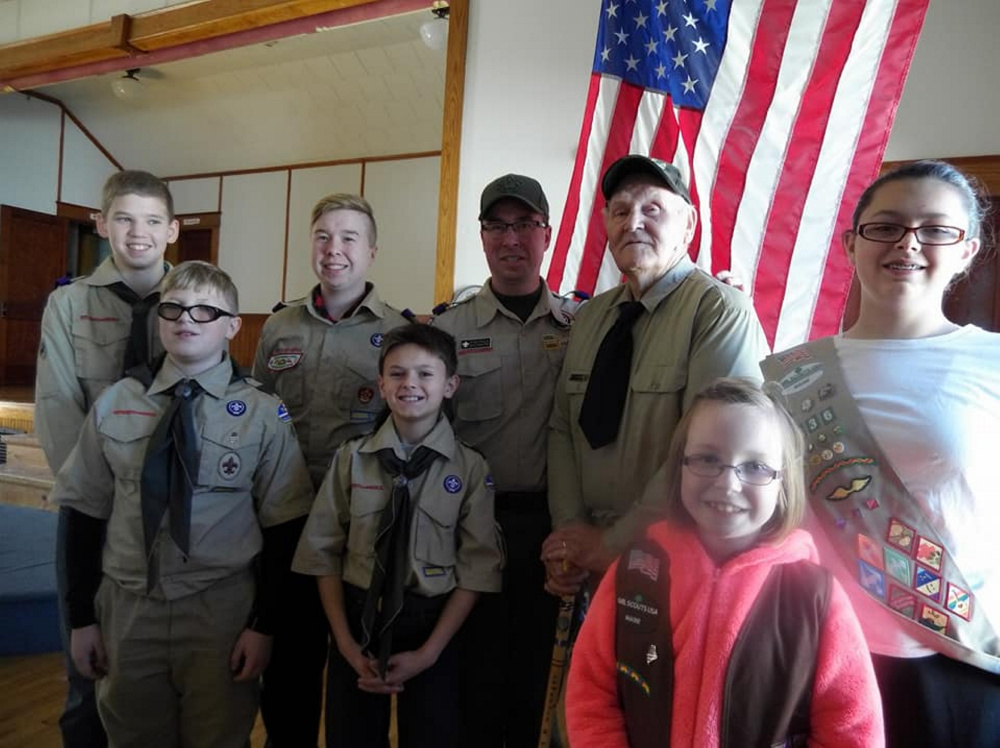 Front, from left, are Brock Stanhope, Robert Spears, Addision Poulin and Kimberly Spears. Back, from left, are Justin Bowman, Dawson Poulin, Troop 401 Scoutmaster Ryan Poulin and Korean War veteran and former Scoutmaster Larry Tibbetts.