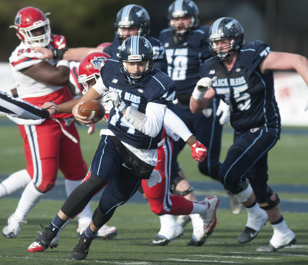 University of Maine ball carrier Chris Fergson rushes for a first down during a game against Stoney Brook on Saturday at Alfond Stadium in Orono.