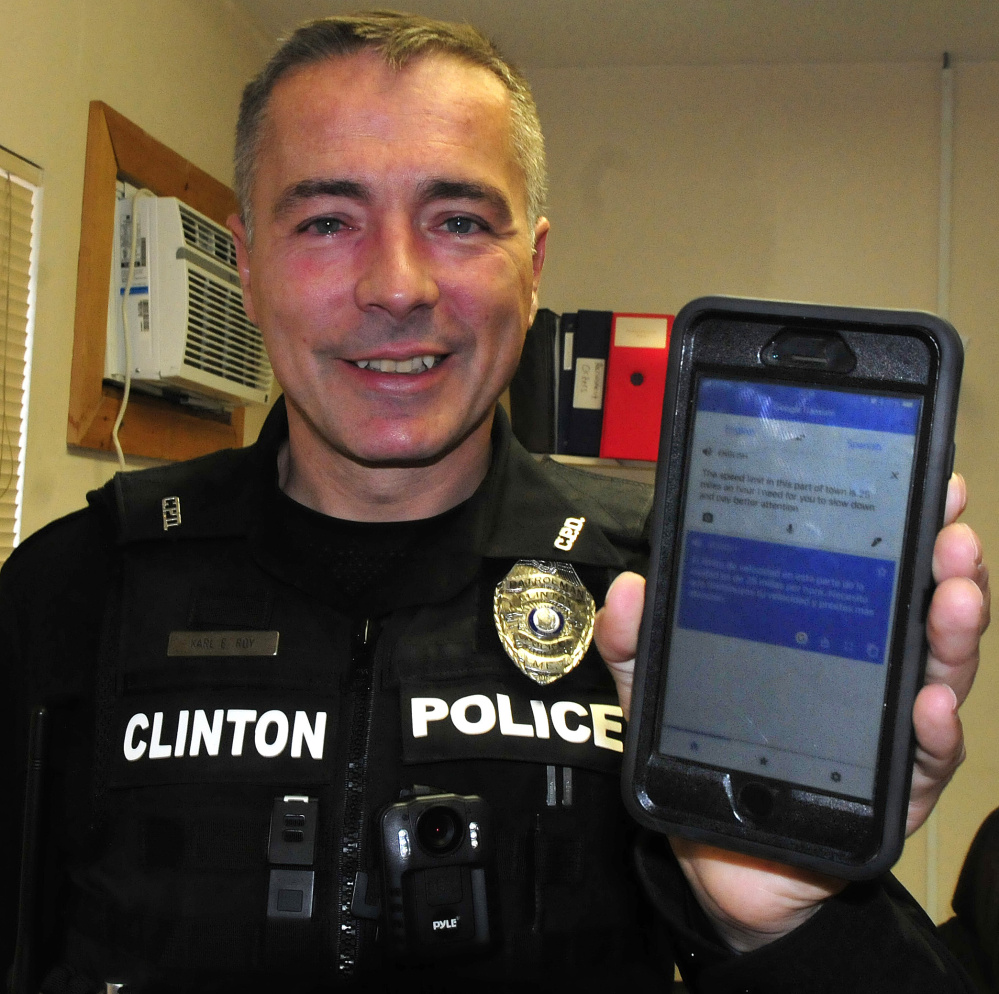 Clinton Patrol Officer Karl Roy holds his cellphone with the Goggle Translator app that he uses to communicate with a person who does not speak English.