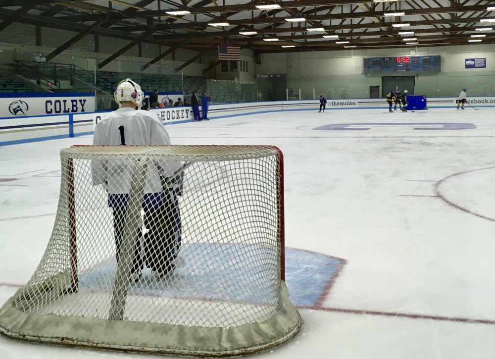 Lawrence/Skowhegan/MCI sophomore goalie Bryson Dostie watches the action during an early morning practice at Colby College on Monday.