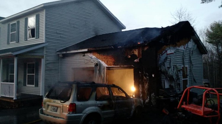 A garage on Red Maple Lane was damaged significantly Tuesday, but quick thinking by an Augusta firefighter kept the fire from spreading to the home.