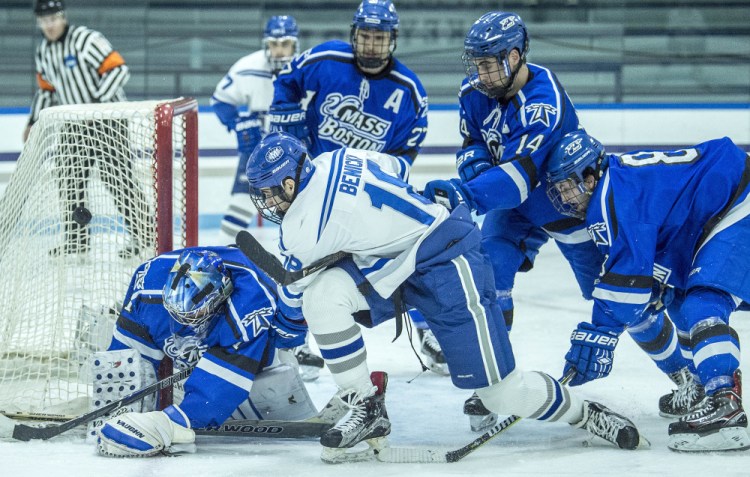 Colby College's Mario Benicky (18) tries to score on University of Massachusetts at Boston goalie Bailey MacBurnie (1) at Colby College in Waterville on Saturday.