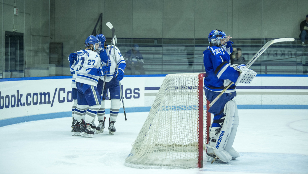 Colby College celebrates their second period goal against University of Massachusetts at Boston on Saturday at Colby College in Waterville.