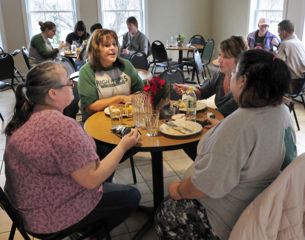 High Hopes Clubhouse Director Lisa Soucie, second from left, has lunch with members Missy Gross, left, and Barbie Smith, at far right, on Wednesday in Waterville. Also having lunch is assistant director Candy Lessard, second from right. The organization has been recognized for having 79 percent of its members employed.