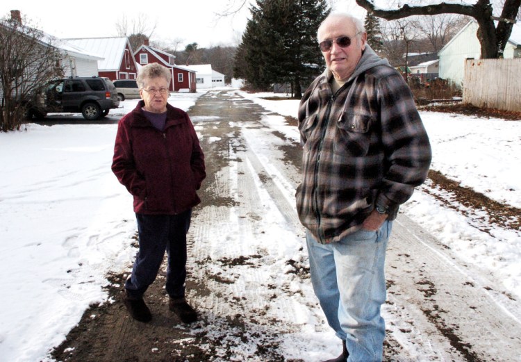 Helene and Charles Bolstridge talked with Skowhegan Selectmen about having their street plowed shortly before they were pictured on it on Dec. 8, 2016. The town was not going to plow the street because it had not been accepted as a street by the town. The Bolstridges and neighbors hired a lawyer who helped solve the problem with the town, which has agreed to plow and sand the street under the terms of a public easement.
