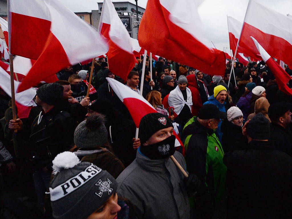 Demonstrators wave Polish flags Saturday in Warsaw during the annual march to commemorate Poland's National Independence Day. Thousands of nationalists marched in an event organized by far-right groups. 