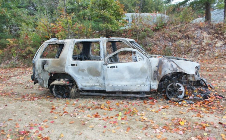 Police found the burned wreckage of the robbery victim's Ford Explorer in New Gloucester, three days after it was stolen.