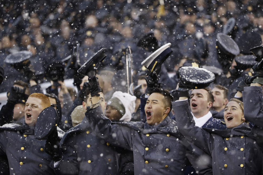 Army Cadets cheer during during Saturday's college football game against Navy in Philadelphia. Army held on for a 14-13 win.