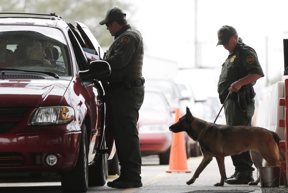 U.S. Customs and Border Patrol agents at a checkpoint station in Falfurrias, Texas. President Trump says he wants to make legal immigration a "merit-based" system.