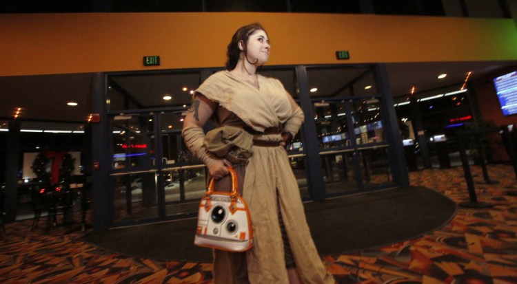 Dressed as Rey, Lane Boucher of Biddeford arrives at Cinemagic in Westbrook for the opening Thursday of "Star Wars: The Last Jedi," the eighth episode in the saga. "I've heard some trepidation out there, but I'm excited," she said. "I'm not too afraid."