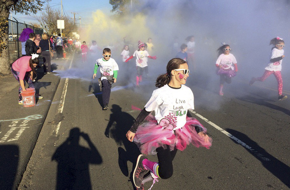 Children participate in the fun run at the Vicki Soto 5K race in Stratford, Conn., in November 2016. The race is held by the Soto family to raise money to fund scholarships.