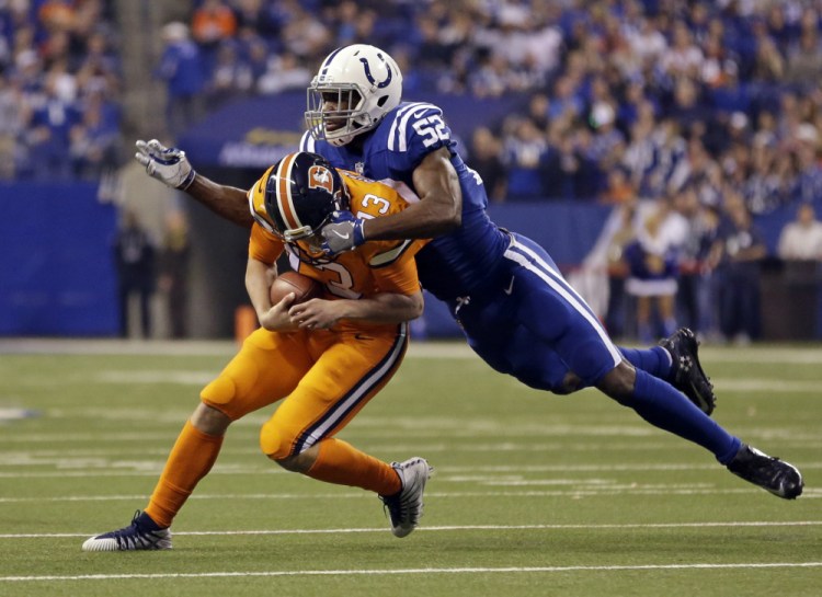 Linebacker Barkevious Mingo of the Indianapolis Colts sacks Denver quarterback Trevor Siemian during the first half of their game Thursday night. The Broncos won, 25-13.