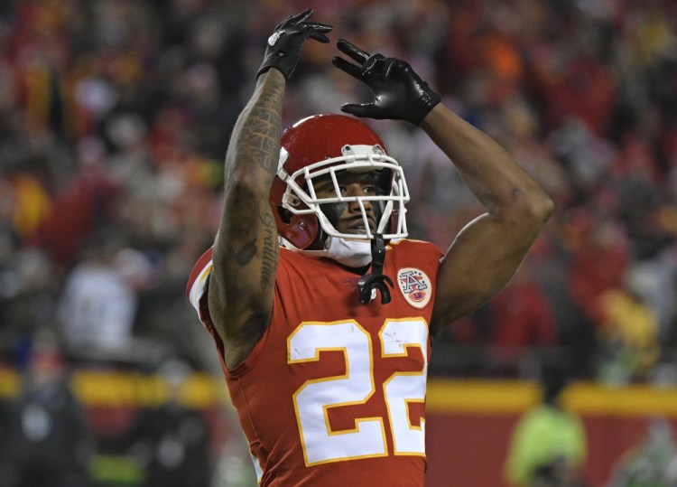 Kansas City defensive back Marcus Peters celebrates after intercepting a pass by Los Angeles quarterback Philip Rivers during the second half Saturday night in Kansas City, Mo. The Chiefs won, 30-13.