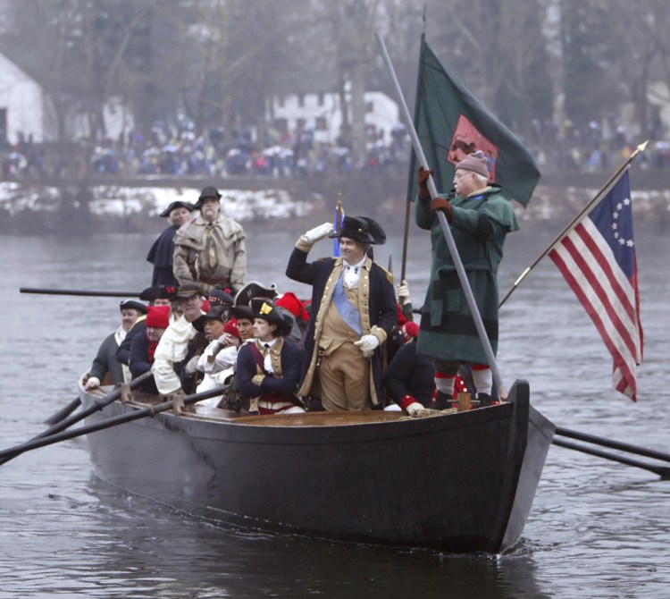 Re-enactor James Gibson waves to spectators as he portrays Gen. George Washington during the 53rd annual Christmas Day crossing of the Delaware River in 2005.