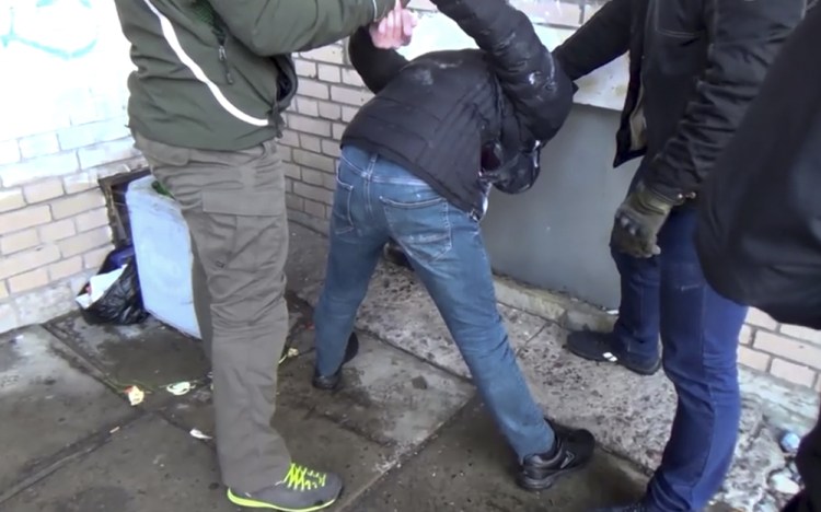 In this undated video grab provided Friday by the RU-RTR Russian television via APTN in Moscow, Russian Federal Security Service operatives detain a suspected member of the Islamic State group's cell in St. Petersburg, Russia.