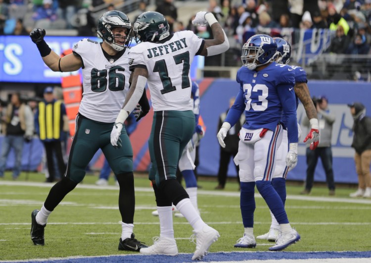 Eagles tight end Zach Ertz, left, celebrates a touchdown catch with wide receiver Alshon Jeffery during a 34-29 win Sunday against the New York Giants.